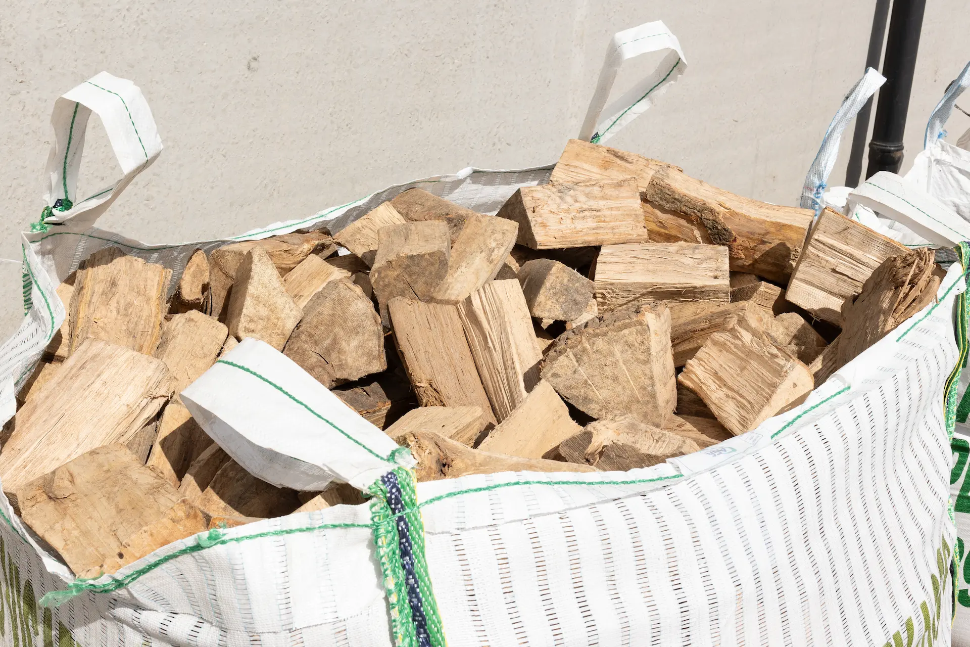 Stacked bagged logs ready for collection